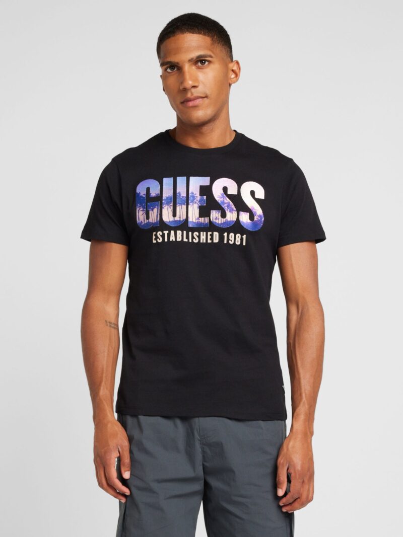 GUESS Tricou 'CITY OF PALMS'  lila / portocaliu caisă / negru