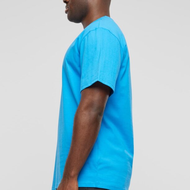 Cumpăra Karl Kani Tricou 'Splash Retro Tee'  albastru aqua