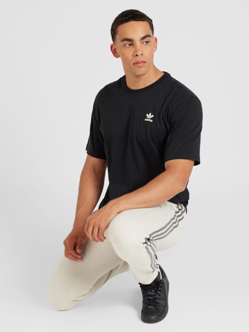 Cumpăra ADIDAS SPORTSWEAR Pantaloni sport 'Essentials'  bej / negru