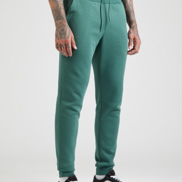 BJÖRN BORG Pantaloni sport 'ESSENTIAL'  verde smarald / negru