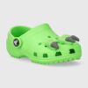 Crocs slapi copii CLASSIC IAM DINOSAUR CLOG culoarea verde