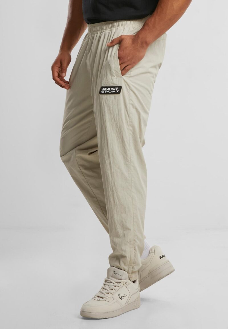 Cumpăra Karl Kani Pantaloni sport 'Patch Essential'  bej / nisipiu