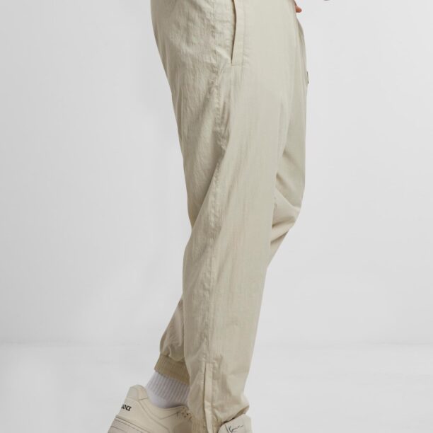 Original Karl Kani Pantaloni sport 'Patch Essential'  bej / nisipiu