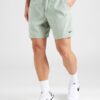 NIKE Pantaloni sport 'FORM'  verde mentă / negru