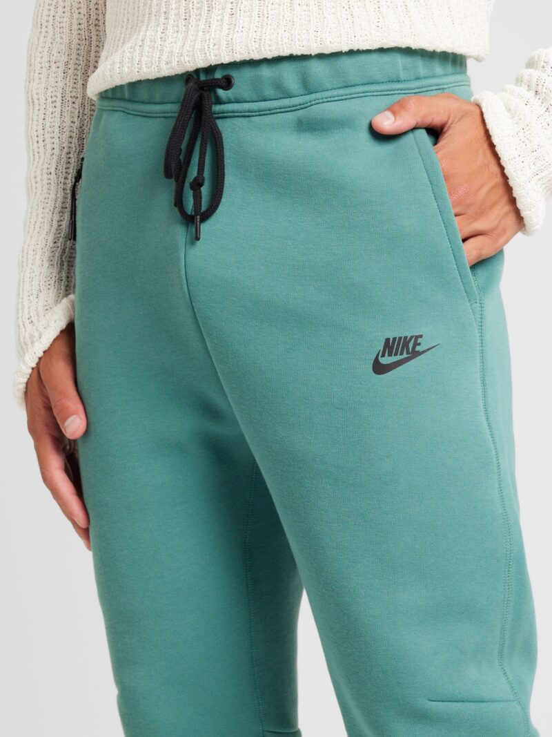 Cumpăra Nike Sportswear Pantaloni 'Tech Fleece'  verde jad / negru