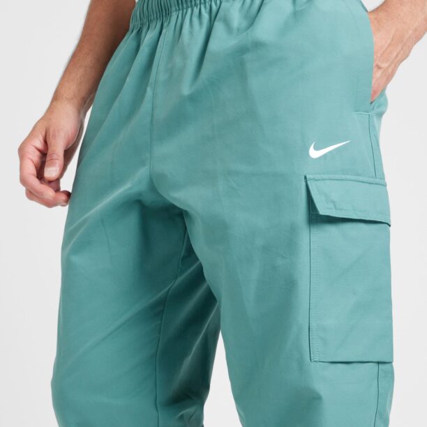 Preţ Nike Sportswear Pantaloni cu buzunare 'AIR PLAY'  turcoaz