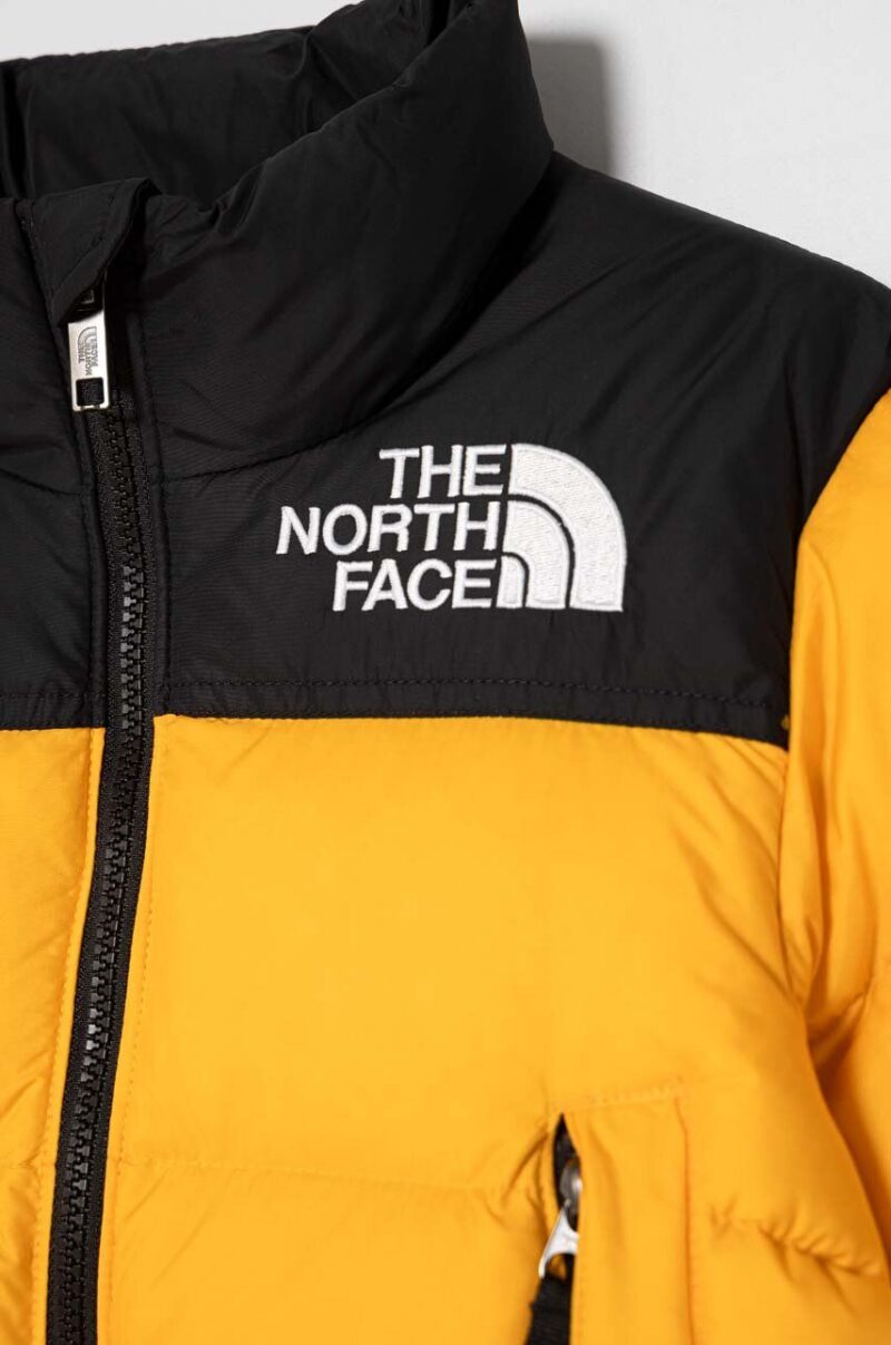 The North Face geaca de puf pentru copii 1996 RETRO NUPTSE JACKET culoarea galben preţ