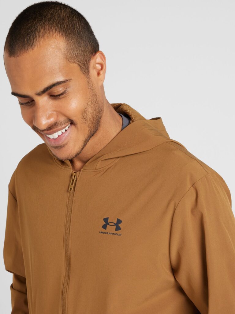 Cumpăra UNDER ARMOUR Geacă sport 'Vibe'  maro caramel / negru