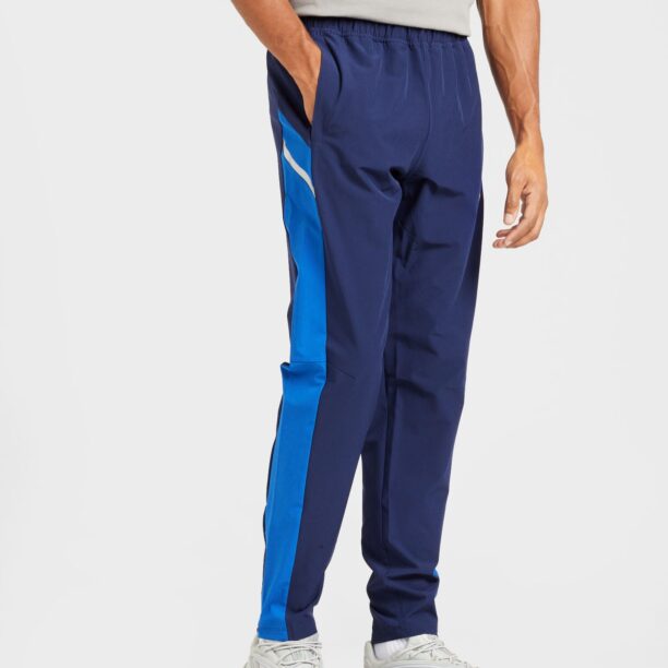 Cumpăra UNDER ARMOUR Pantaloni sport 'Utility'  albastru / albastru închis / alb