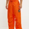 The North Face pantaloni TNF x Yinka Ilori culoarea portocaliu