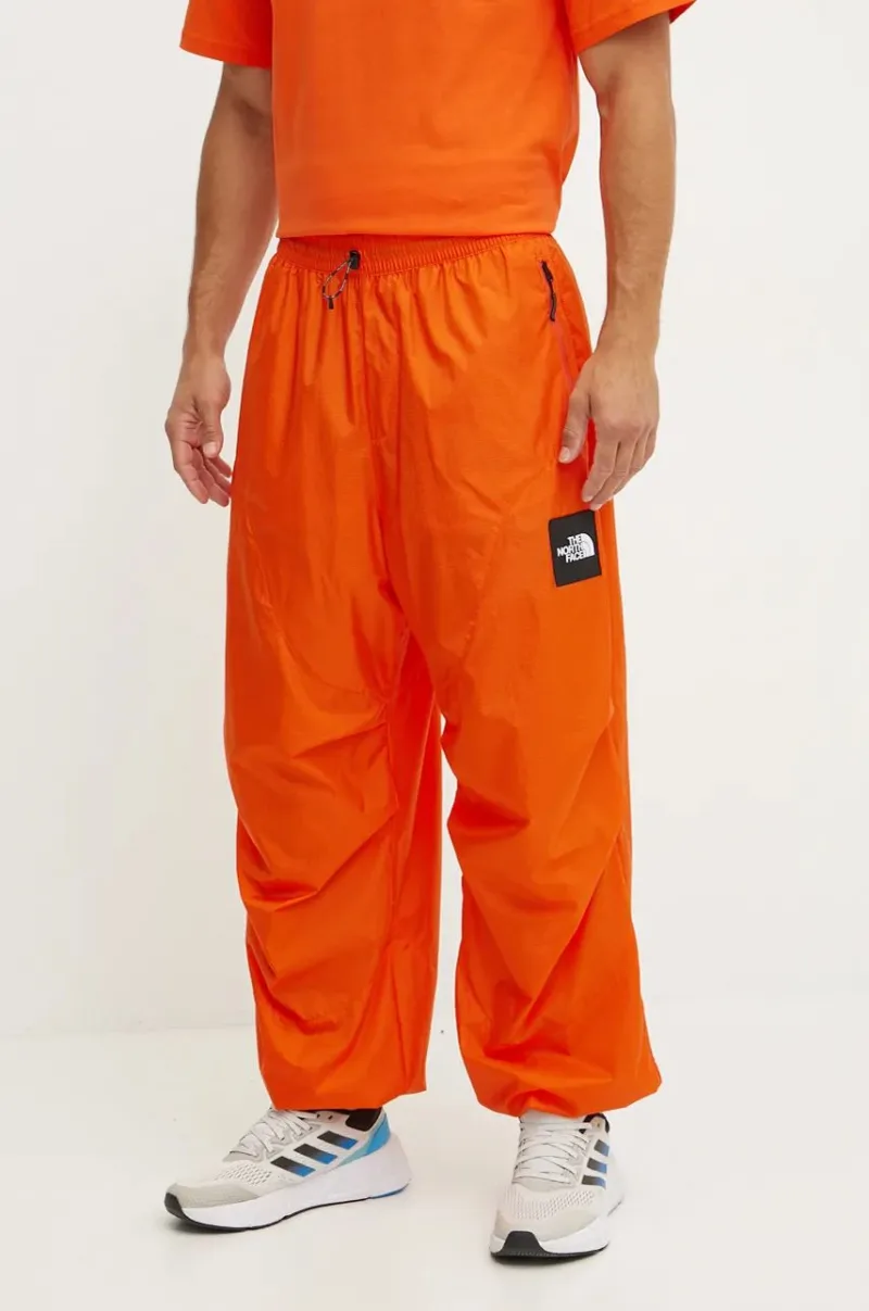 The North Face pantaloni TNF x Yinka Ilori culoarea portocaliu