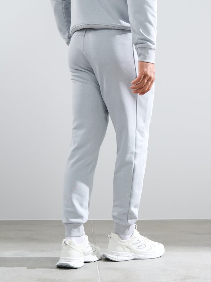 Cumpăra Pantaloni de trening slim jogger SNSY PERFORMANCE - gri deschis