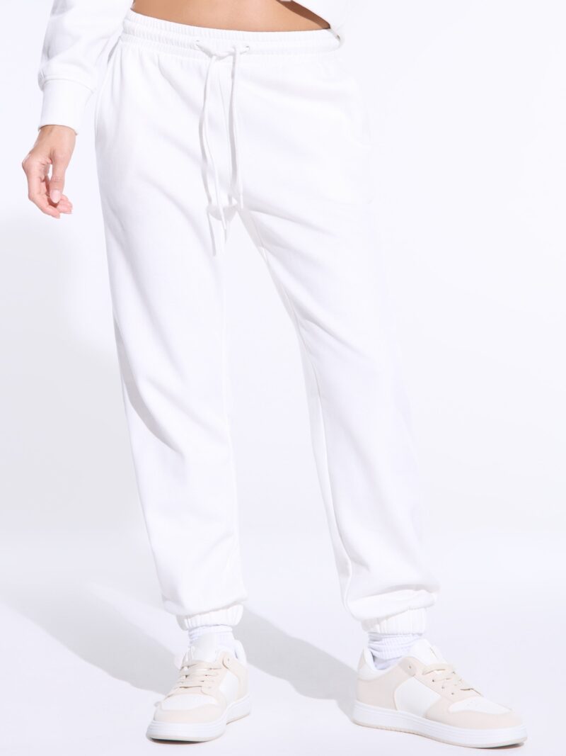 Pantaloni sport - crem preţ